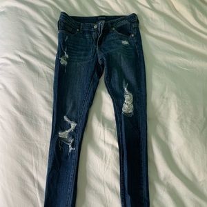 Ripped low rise skinny jeans